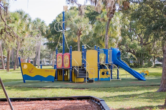 community play area featuring a lawn