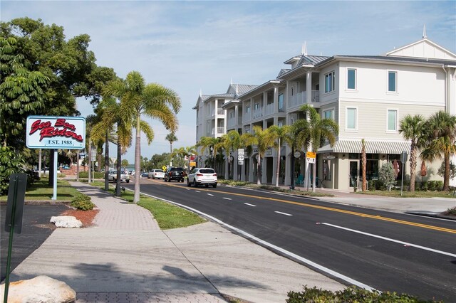 view of street featuring traffic signs and sidewalks