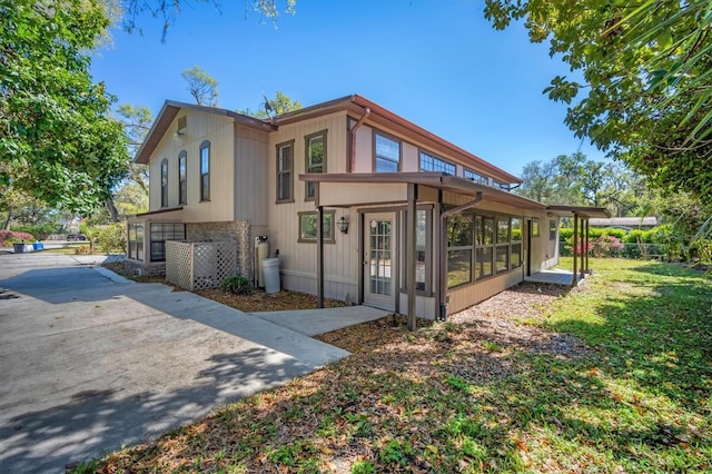 exterior space featuring a sunroom