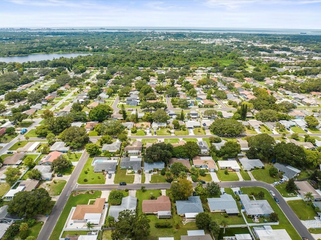 drone / aerial view featuring a water view and a residential view