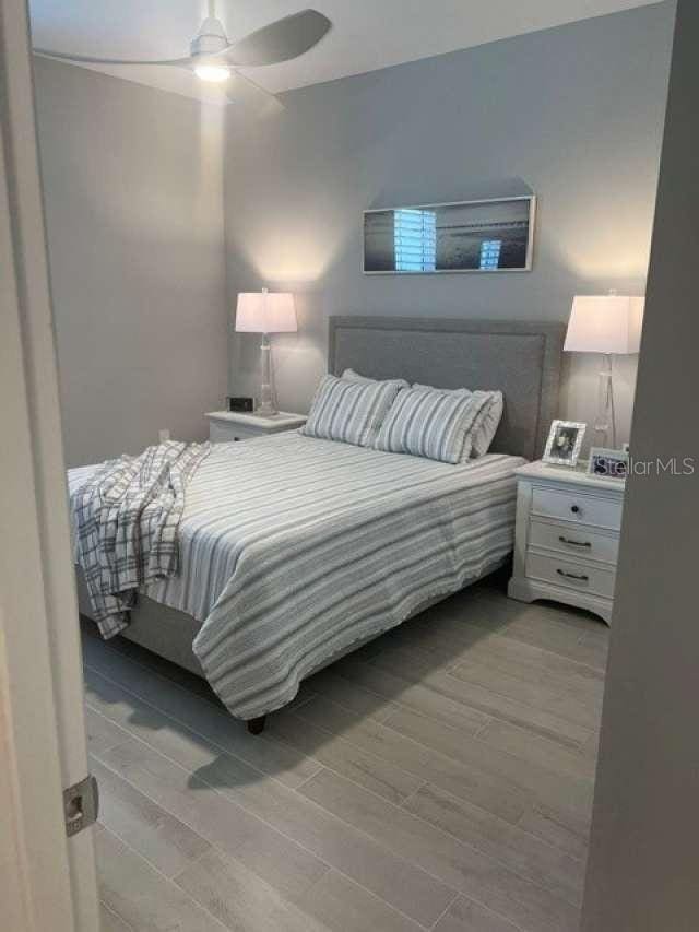 bedroom featuring ceiling fan and light wood-style floors