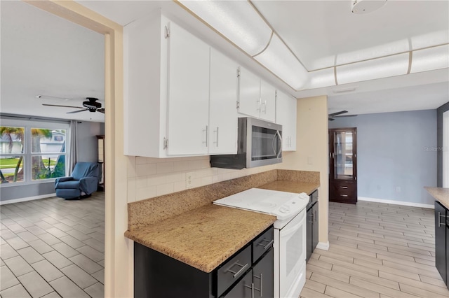 kitchen with ceiling fan, decorative backsplash, white cabinets, stainless steel microwave, and white electric range