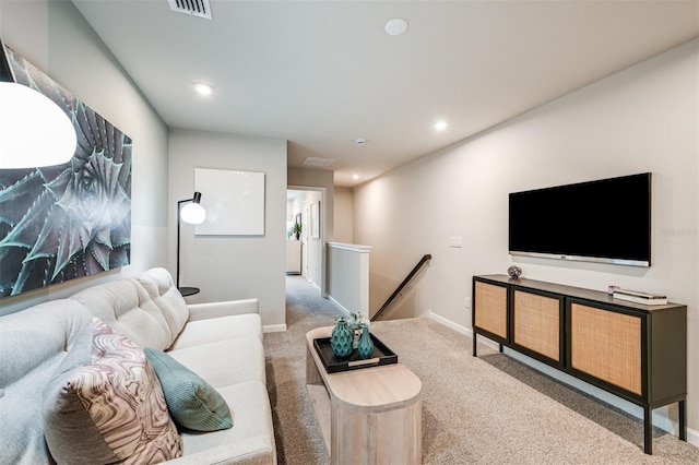 living area featuring carpet, visible vents, baseboards, and recessed lighting