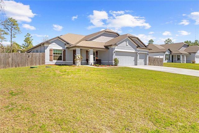 view of front of home featuring stucco siding, an attached garage, fence, driveway, and a front lawn