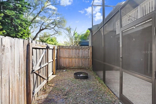 view of yard with fence and a gate