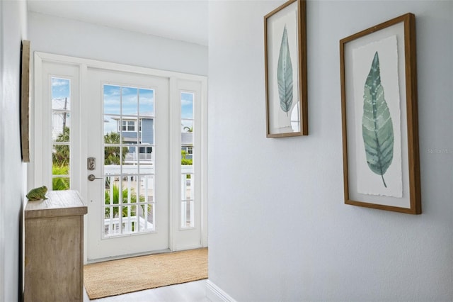 entryway with a healthy amount of sunlight and wood finished floors