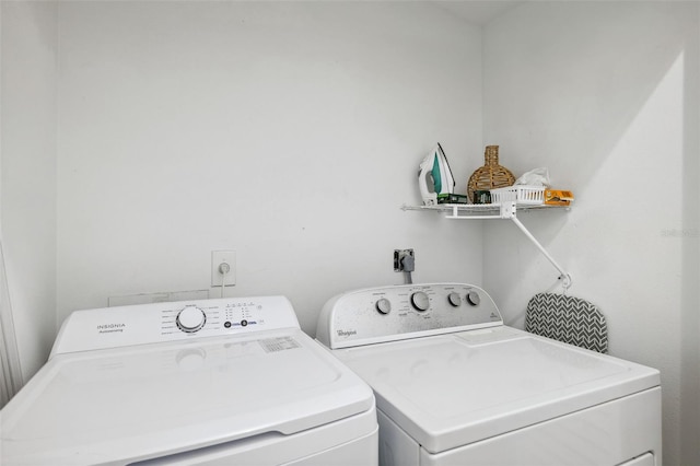 clothes washing area with laundry area and separate washer and dryer