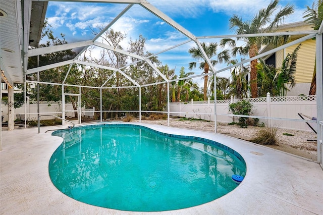 view of pool with a lanai, a fenced backyard, a fenced in pool, and a patio area