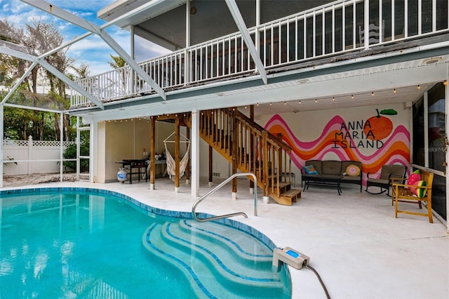 view of pool featuring a patio, fence, a fenced in pool, a lanai, and stairs