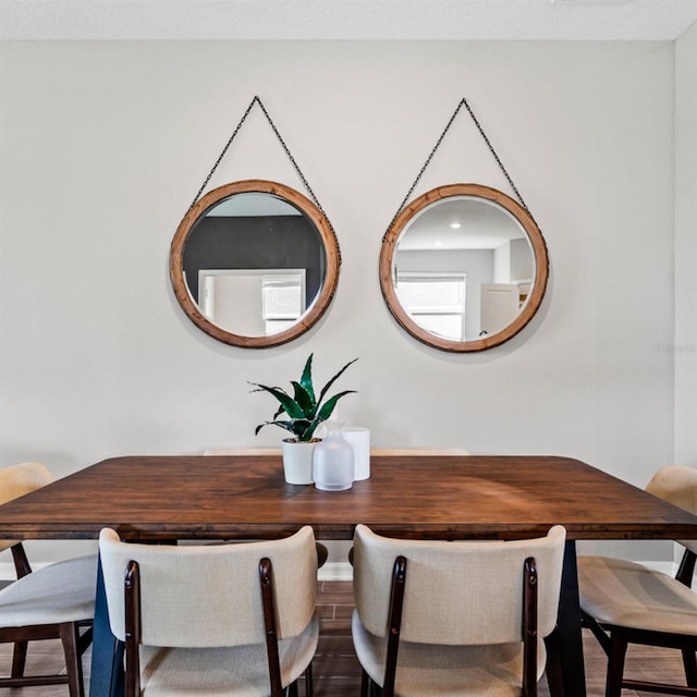 dining space featuring wood finished floors