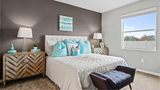 bedroom featuring carpet floors and baseboards