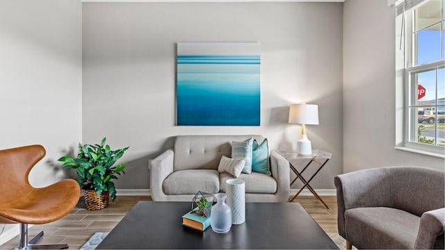 living room with wood tiled floor and baseboards