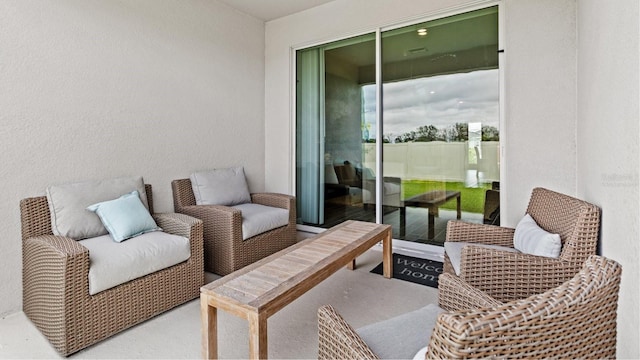 view of patio featuring a balcony