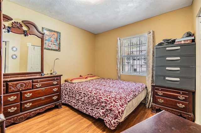 bedroom featuring wood finished floors