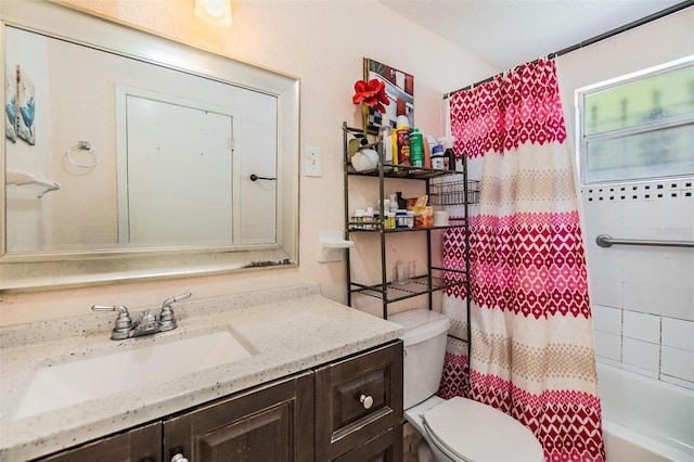 bathroom featuring shower / tub combo, toilet, and vanity