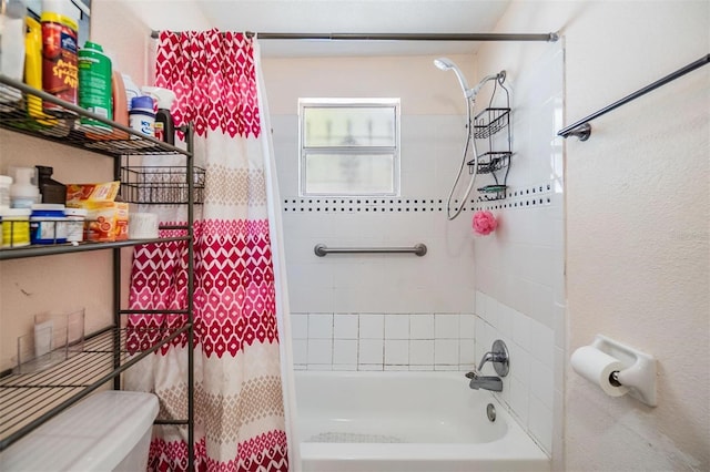 bathroom featuring toilet and shower / bath combo