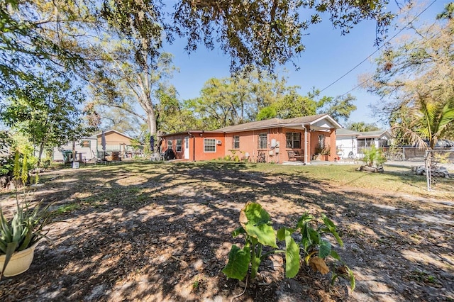 view of front of home featuring fence