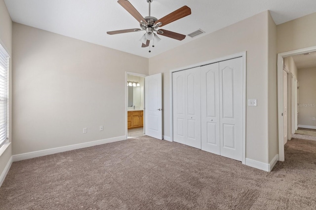 unfurnished bedroom featuring ceiling fan, carpet flooring, visible vents, baseboards, and a closet