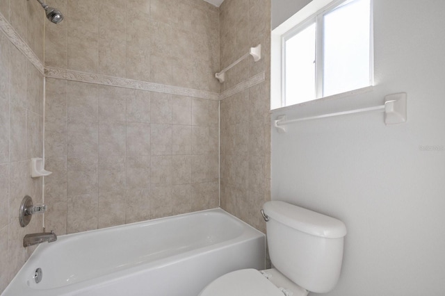 bathroom with toilet and shower / tub combination