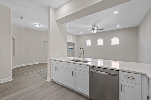 kitchen with a sink, ceiling fan, white cabinetry, and dishwasher