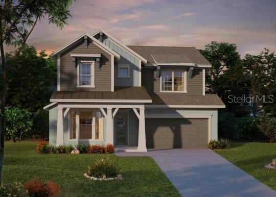 view of front of house with an attached garage, a front lawn, and concrete driveway