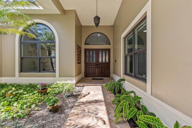 doorway to property with stucco siding