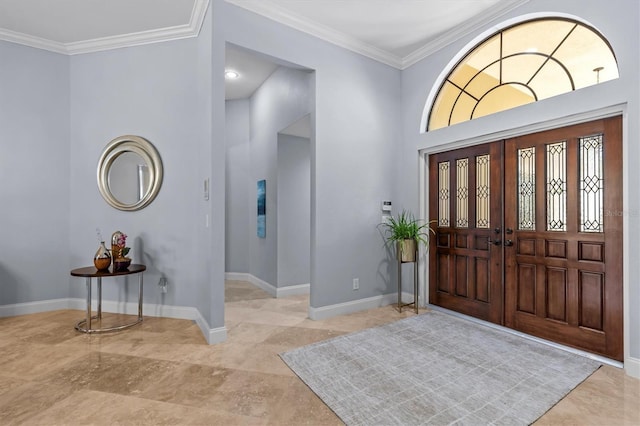 foyer entrance featuring baseboards and crown molding