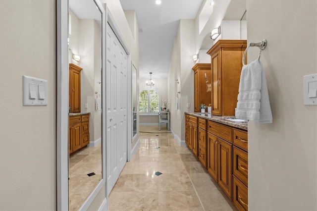 bathroom with vanity and baseboards