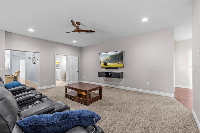 living area with recessed lighting, light carpet, a ceiling fan, baseboards, and visible vents