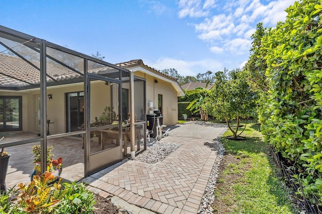 view of patio with a lanai