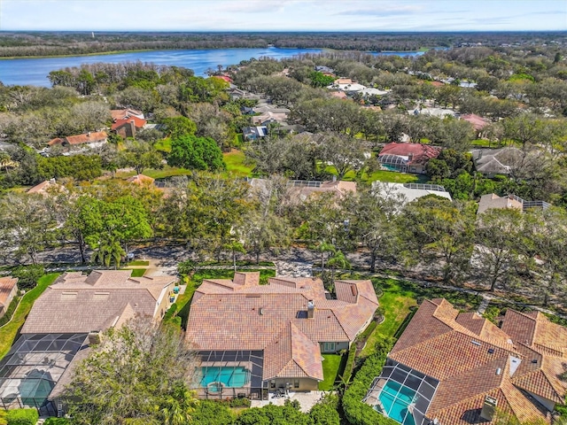 drone / aerial view featuring a water view and a residential view