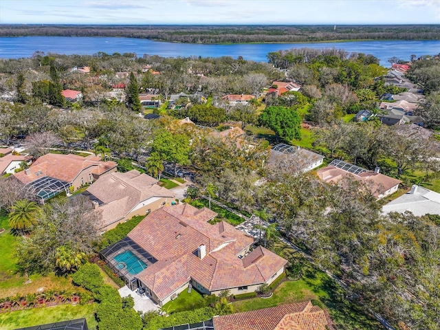 birds eye view of property with a water view and a residential view