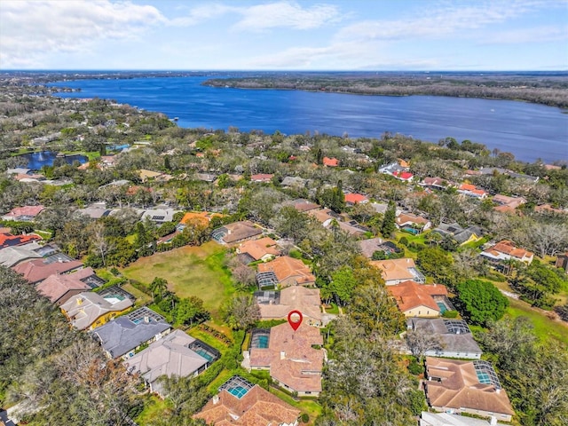 bird's eye view featuring a water view and a residential view