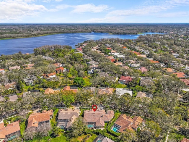 birds eye view of property featuring a water view and a residential view