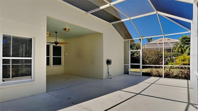 view of patio / terrace with a lanai and a ceiling fan