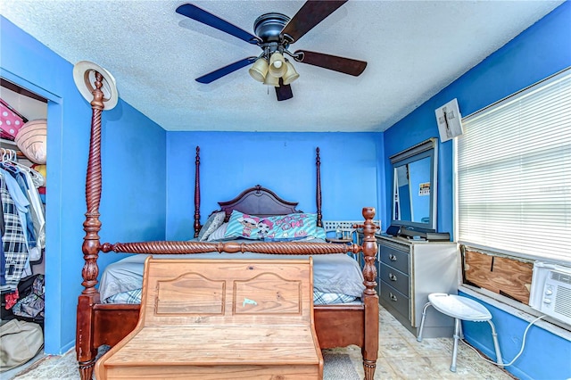 bedroom featuring a textured ceiling and a ceiling fan