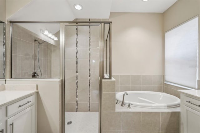 bathroom featuring recessed lighting, vanity, a shower stall, and a bath