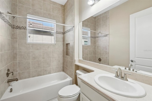 bathroom with toilet, shower / washtub combination, and vanity