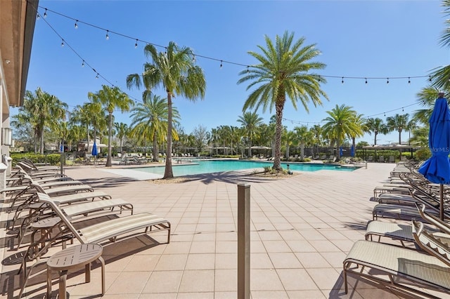 community pool with a patio area