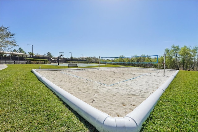 view of home's community featuring community basketball court, a lawn, and volleyball court