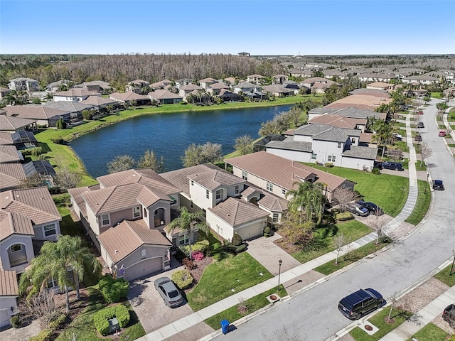 birds eye view of property with a residential view and a water view