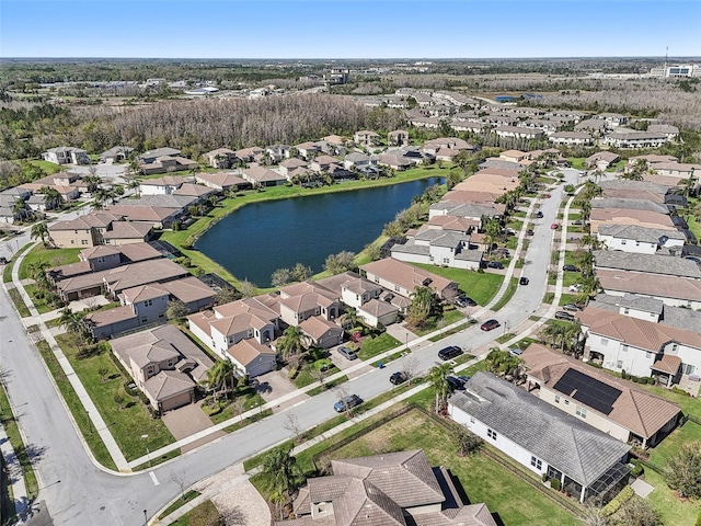 bird's eye view featuring a residential view and a water view