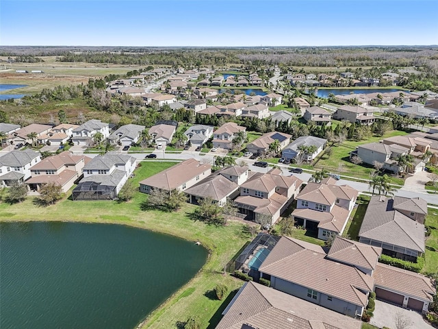 aerial view featuring a water view and a residential view