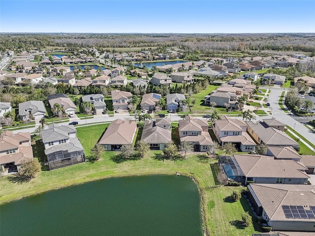 birds eye view of property featuring a residential view and a water view