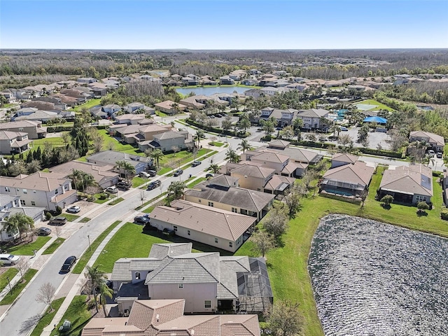 birds eye view of property with a water view and a residential view