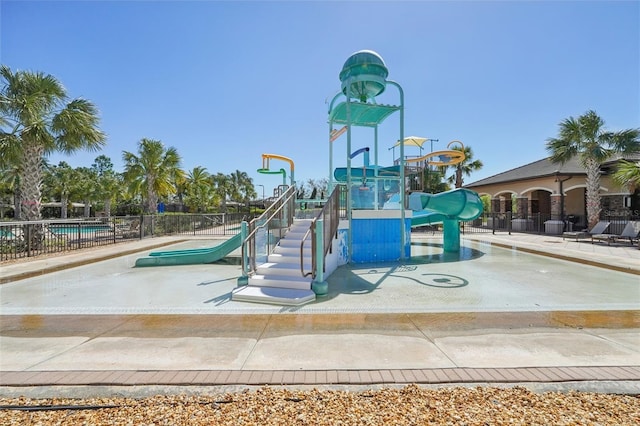 communal playground featuring fence