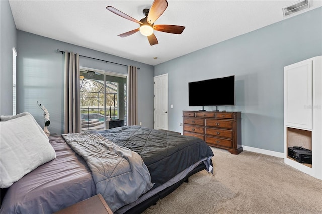 bedroom featuring visible vents, light carpet, a ceiling fan, baseboards, and access to exterior