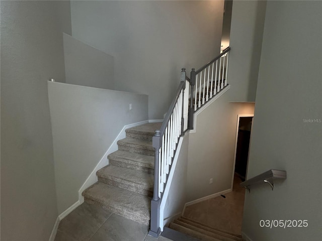 stairway featuring baseboards