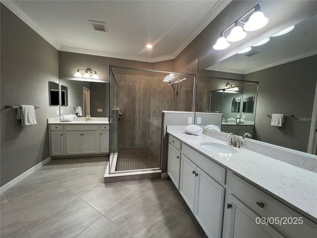 full bath featuring visible vents, a sink, crown molding, a shower stall, and two vanities