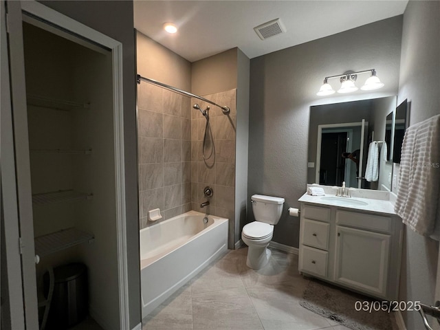 full bathroom featuring visible vents, toilet, tub / shower combination, vanity, and baseboards